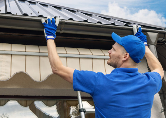 Man-installing-gutter Man-installing-gutter